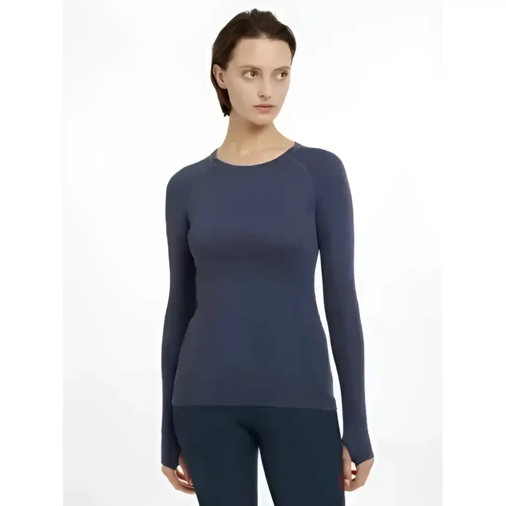 A sleek navy blue dusk blue long sleeve athletic top with seamless construction lemieux britney seamless design