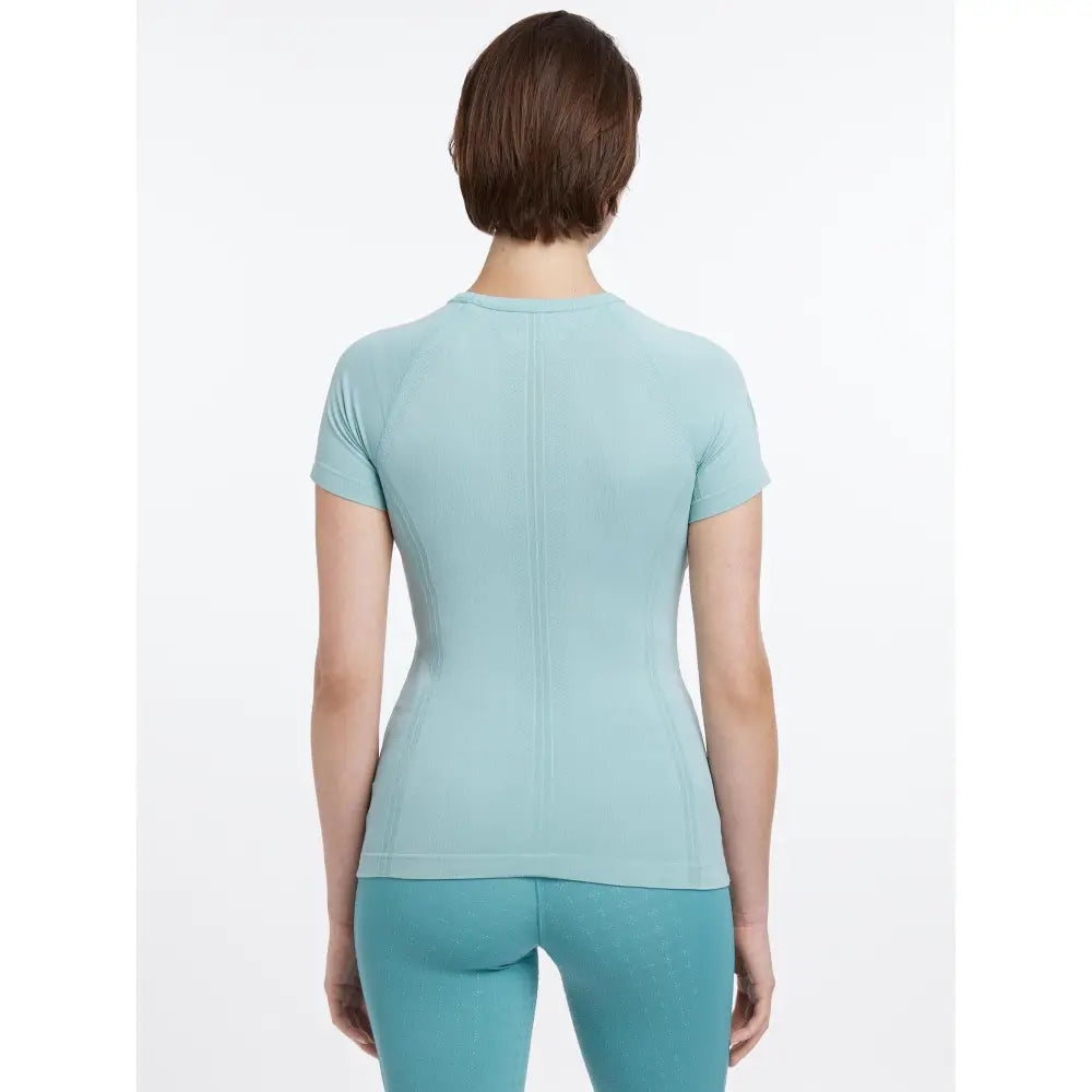 Aqua lemieux britney seamless short sleeve athletic top shown from the back with a rounded neckline and central seam