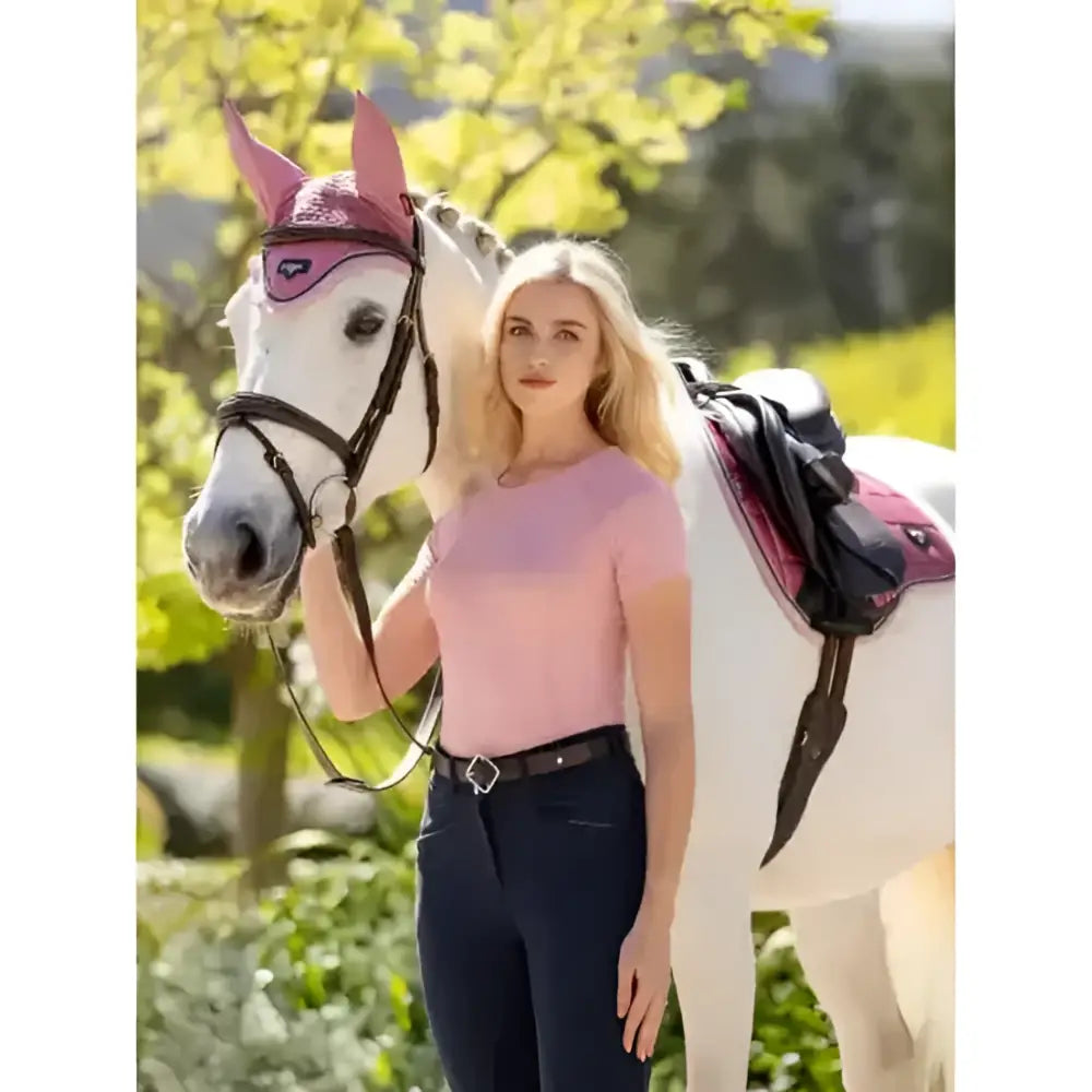 Pink horse eye protection with black straps and heart cutout paired with lemieux britney seamless short sleeve top blossom
