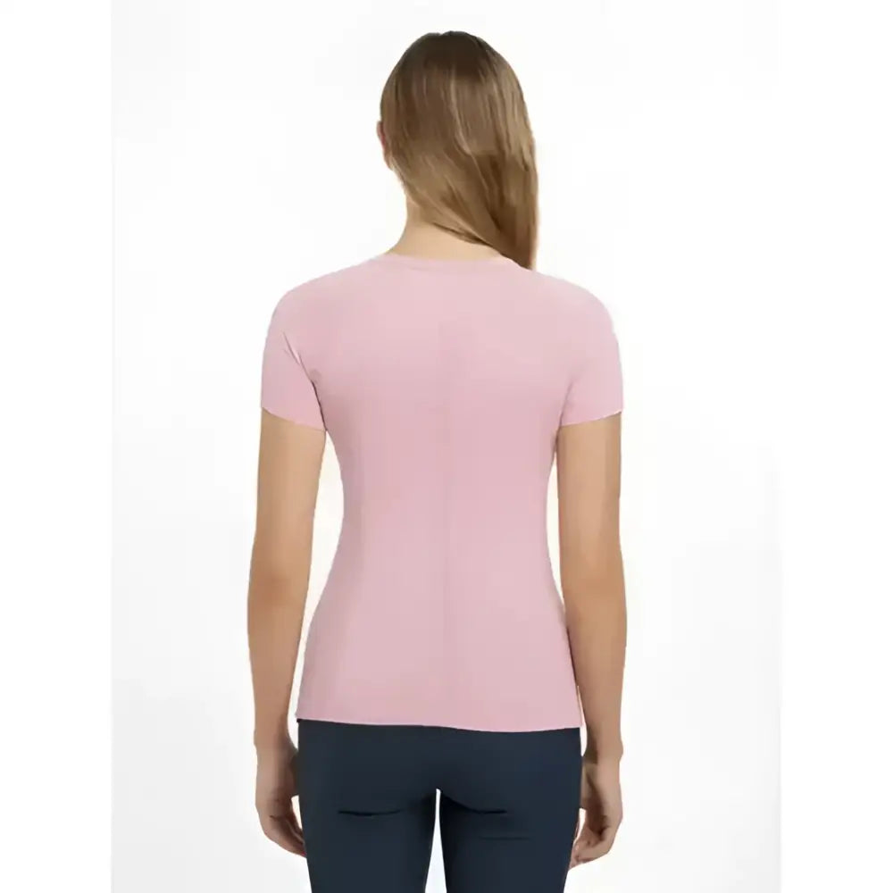 A soft pink lemieux britney seamless short sleeve top with a rounded neckline and subtle vertical seam detail