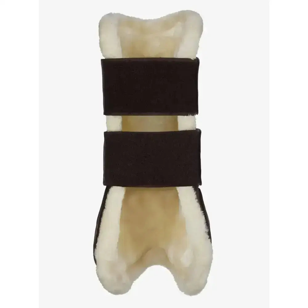 Cream-colored sheepskin lemieux capella comfort tendon boots with dark brown velour straps for cutting edge protection