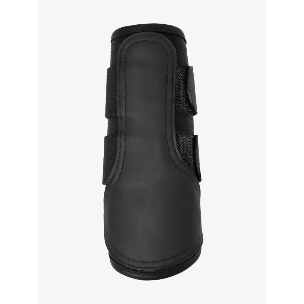 Black lemieux capella leather brushing boots with adjustable velcro straps and stitched seams for hoof protection