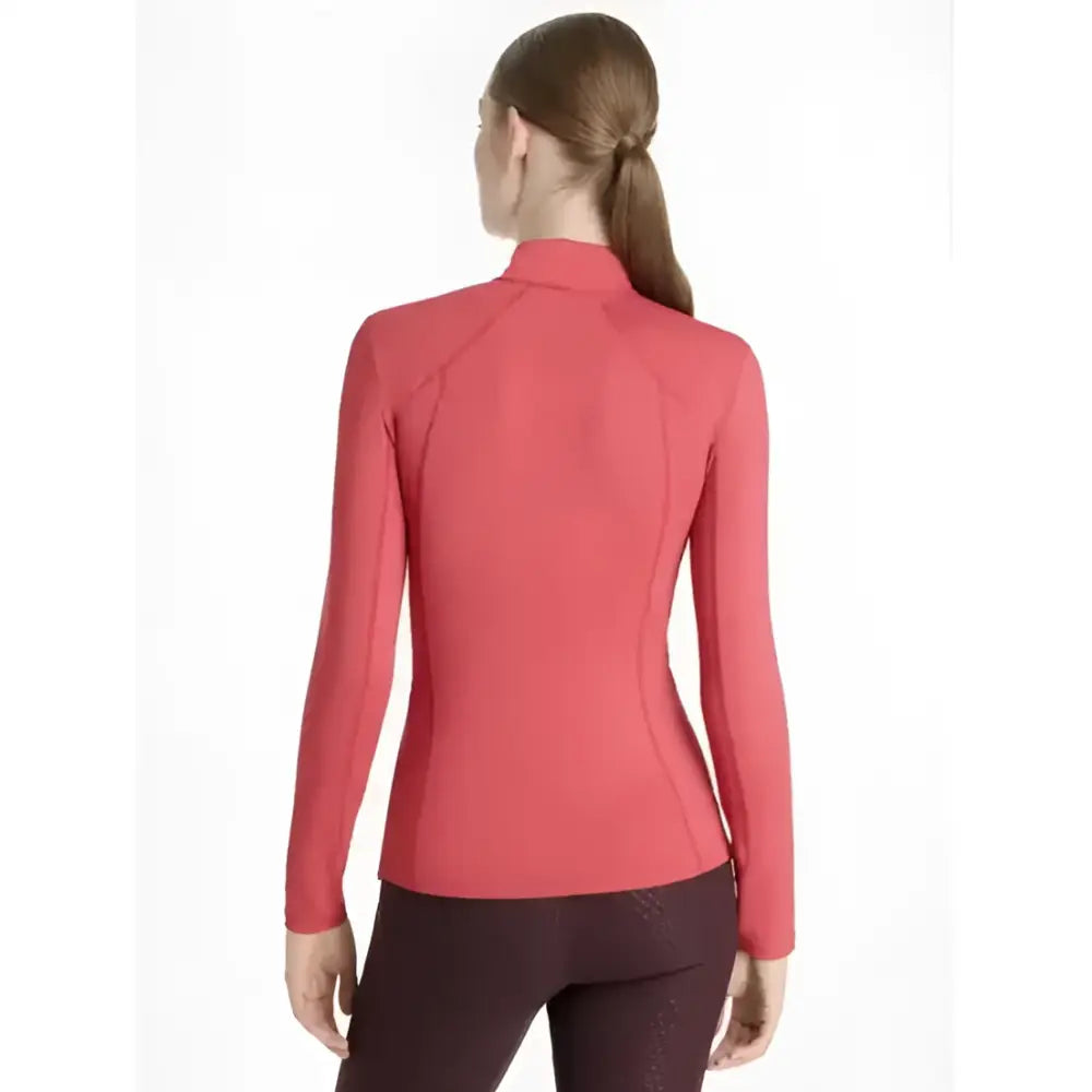 A coral-colored seamless lemieux classique base layer cranberry with long sleeves and a high collar for athletic wear