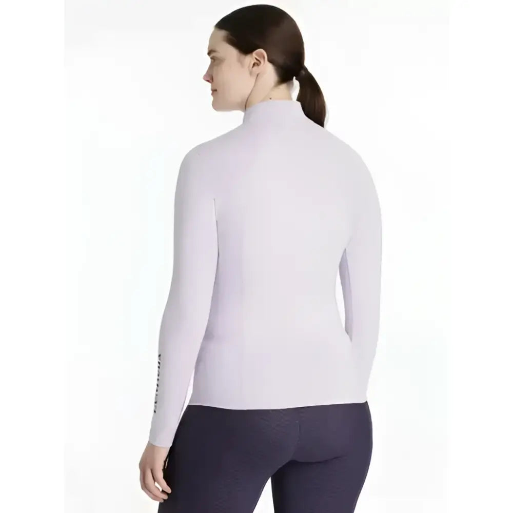 A soft lavender lemieux classique base layer lilac long-sleeve top with a sleek high-neck and form-fitting design