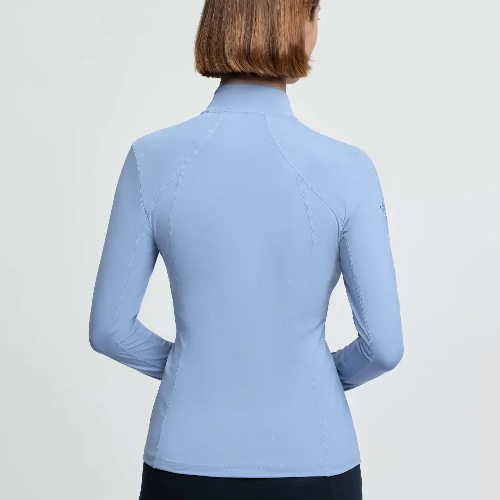 Light blue long-sleeved athletic jacket with vented underarms and high collar lemieux classique base powder blue