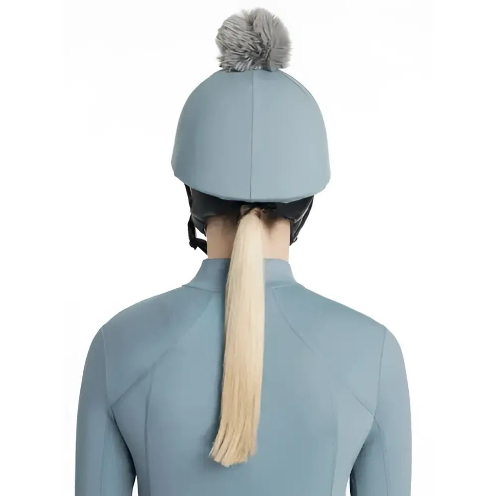 Light blue lemieux classique pom equestrian helmet with gray faux fur pom hat silk ice blue on top