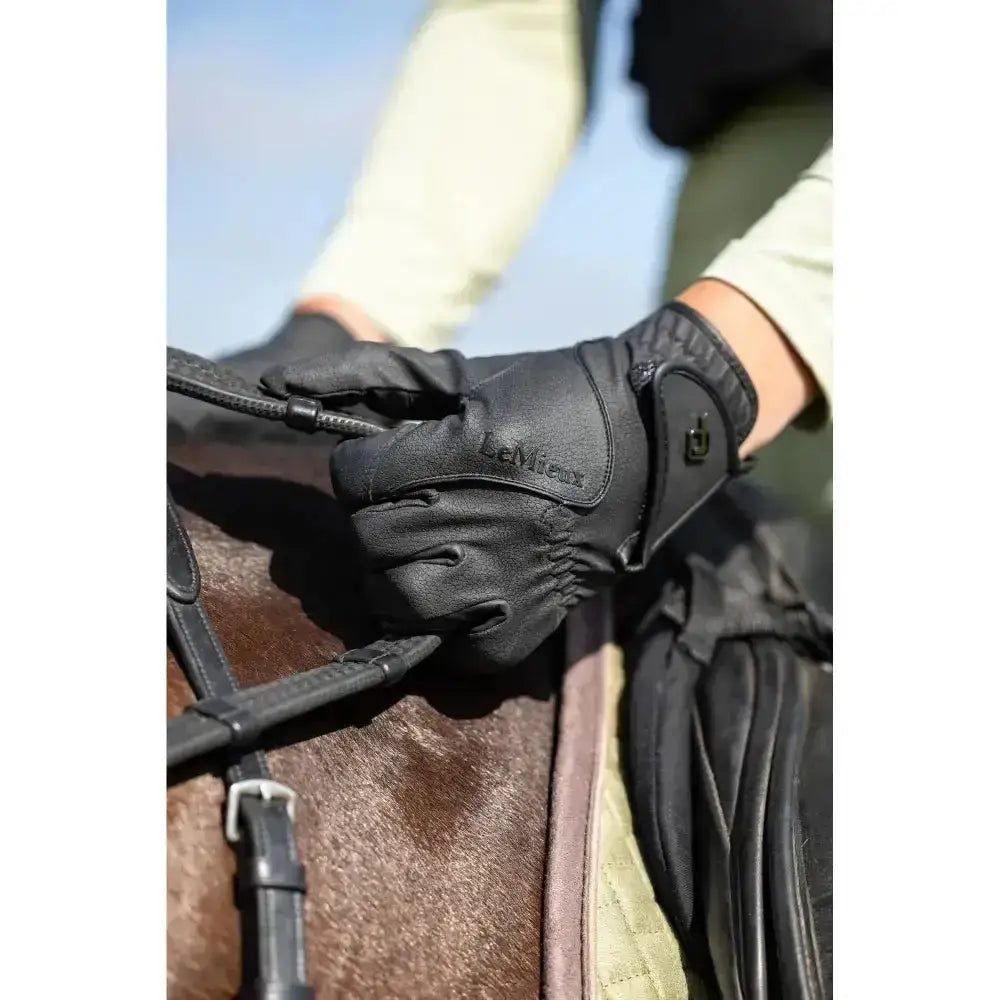 Black leather lemieux close contact glove with embossed branding and reinforced stitching in innovative technical fabric