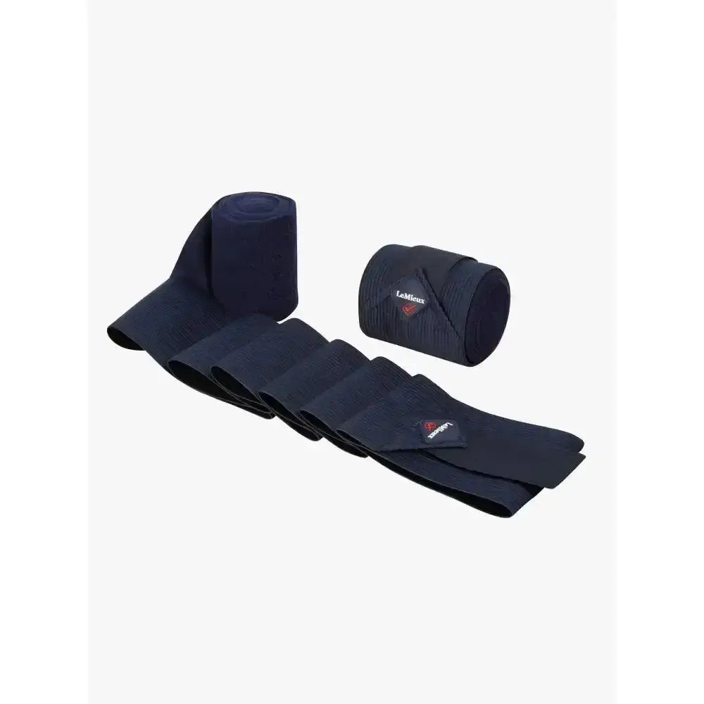 Black lohmann lemieux combi bandages navy rolls with one unrolled showing texture perfect as tail bandages