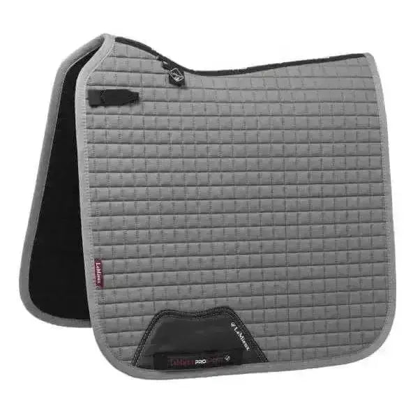 Gray quilted lemieux cotton dressage square with black trim and branded logo patch for dressage use