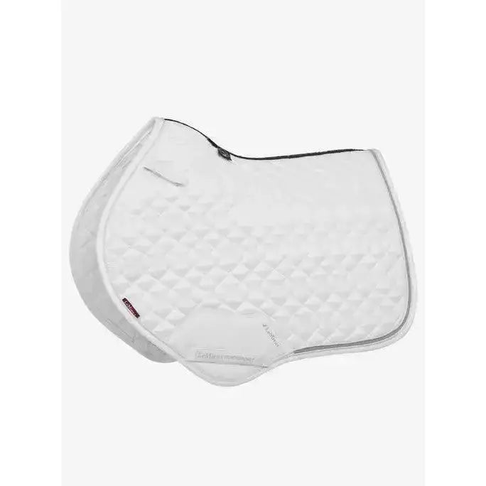 White quilted lemieux crystal suede close contact square saddle pad with black trim and subtle diamond pattern for forward-cut jumping saddles