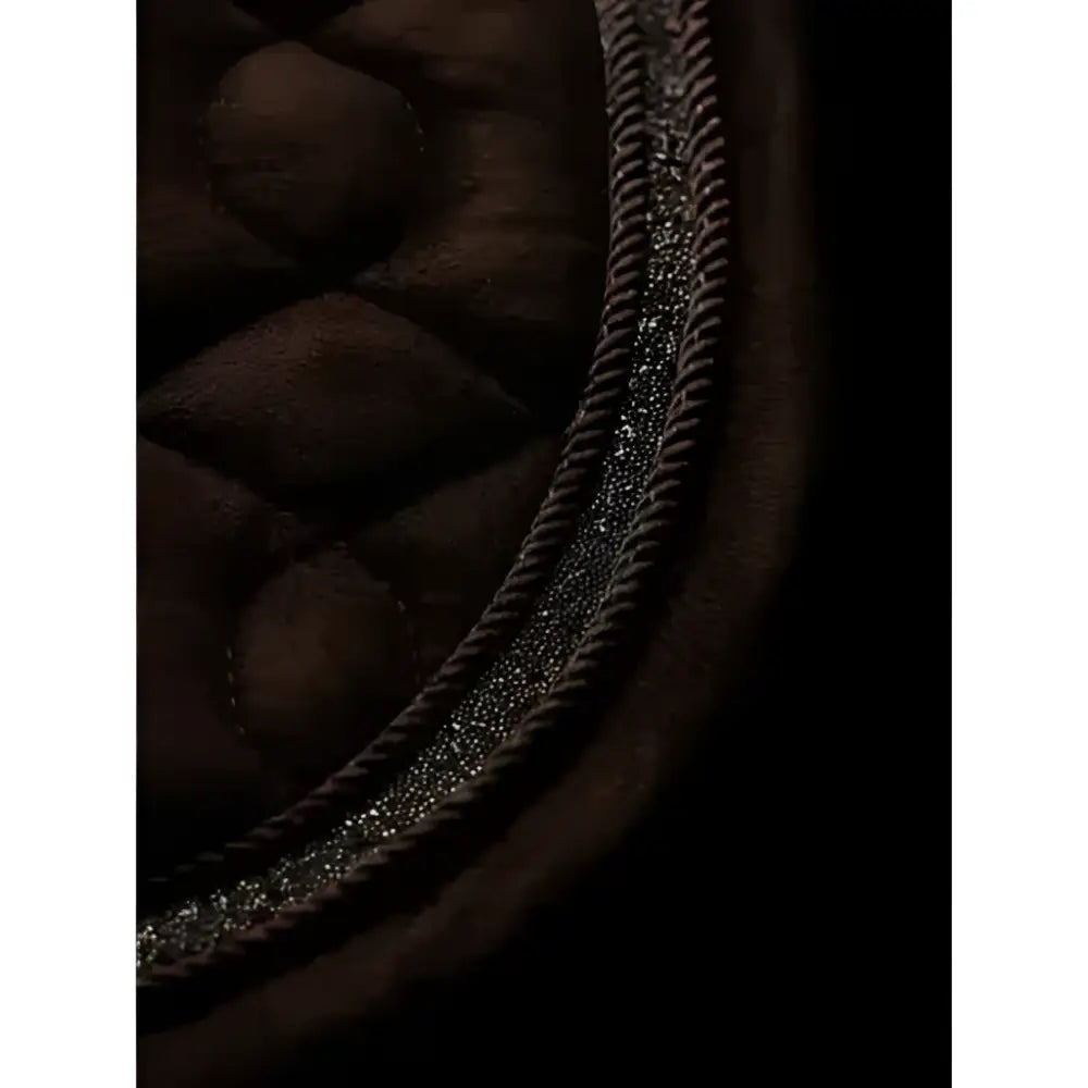 Dark brown lemieux crystal suede dressage square with leather girth protection and silver glittery trim along the edge