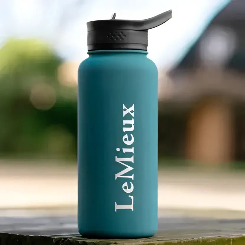 Teal insulated lemieux drinks bottle jungle with black flip-top lid and white lemieux branding for easy hydration
