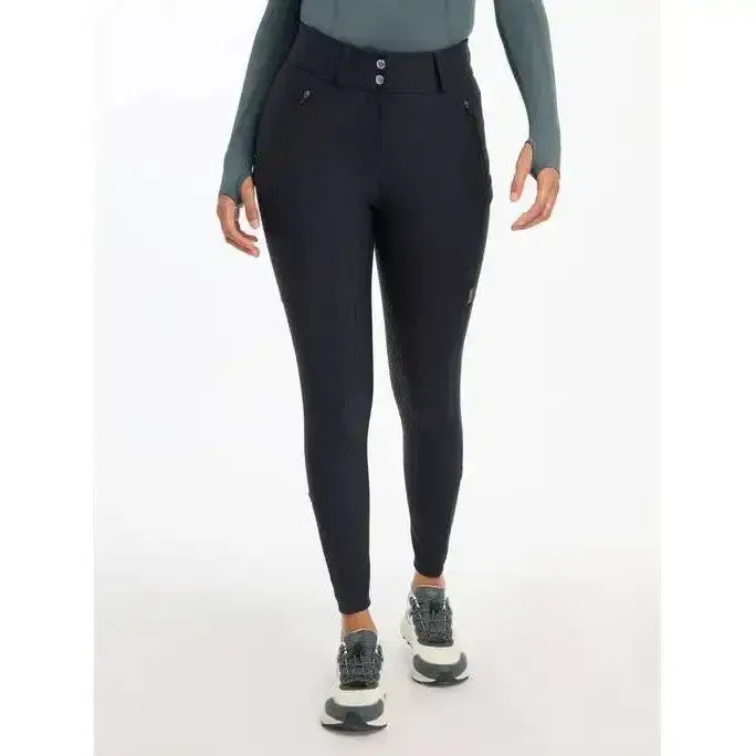 Black lemieux drytex waterproof breeches with high waist button closure and textured thigh panels for all-weather riding