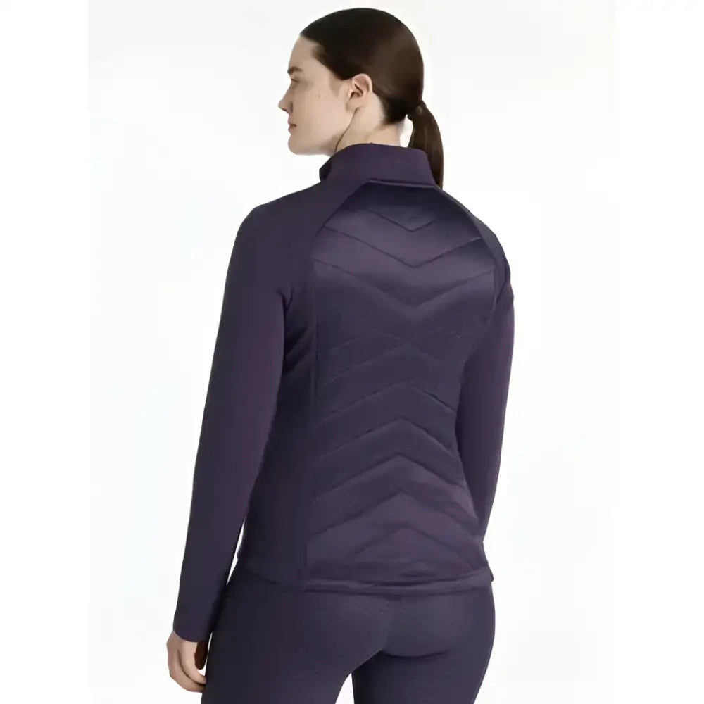 Back view of purple quilted lemieux dynamique jacket with chevron pattern on juniper jacket perfect for chilly days