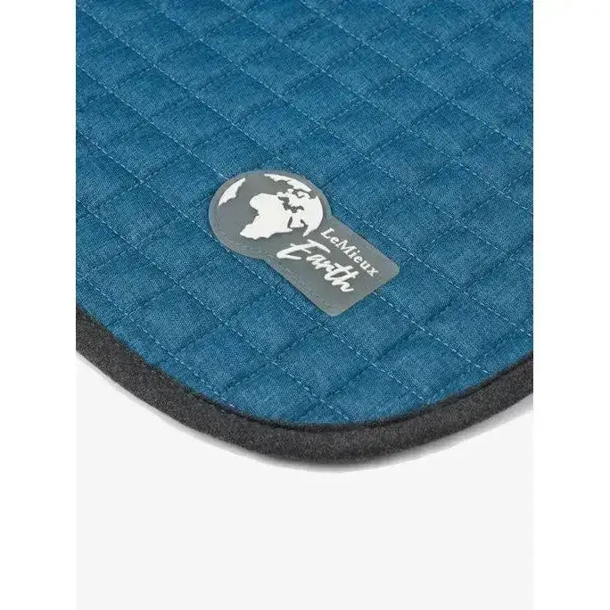 Teal quilted lemieux earth close contact square saddle pad with gray logo patch perfect for close contact saddles