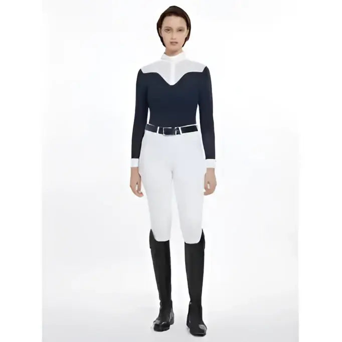 Black and white lemieux emily long sleeve competition shirt with high collar and white shoulder panels paired with white pants