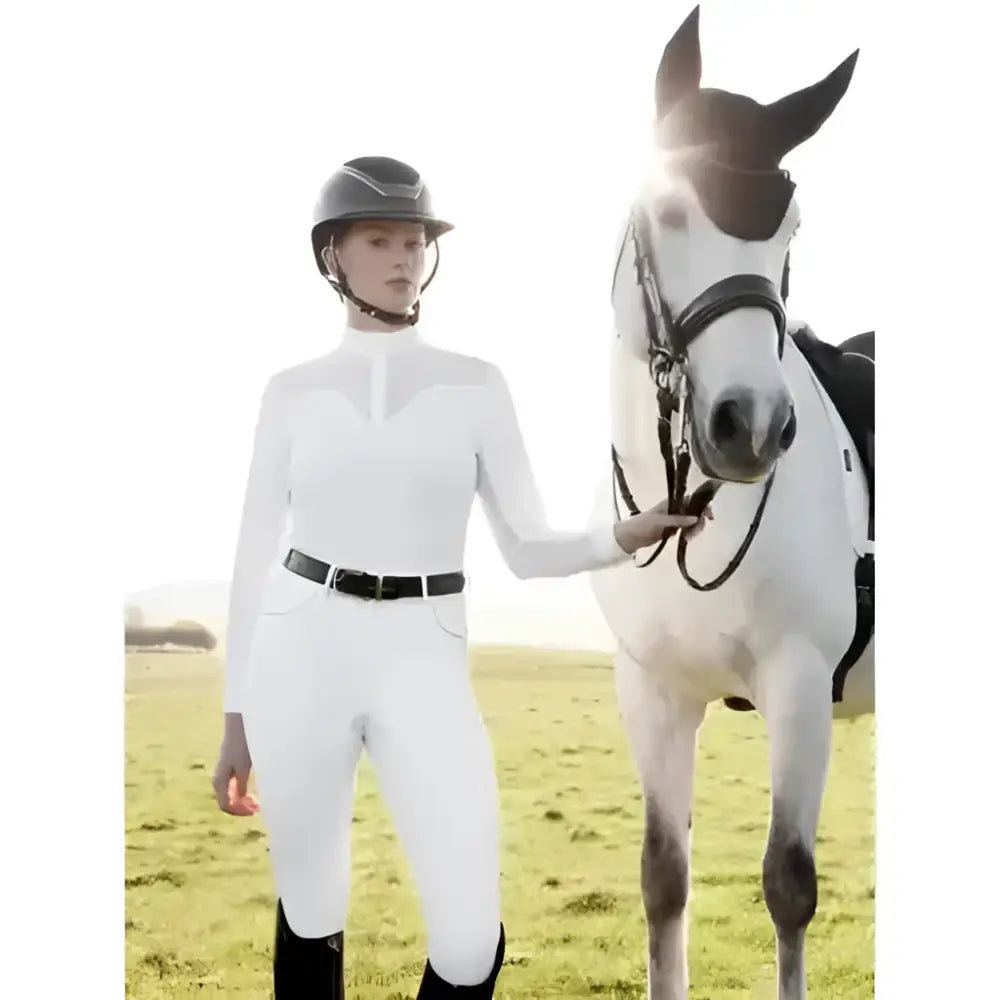 White lemieux emily long sleeve shirt with black belt and matching helmet perfect for equestrian shows