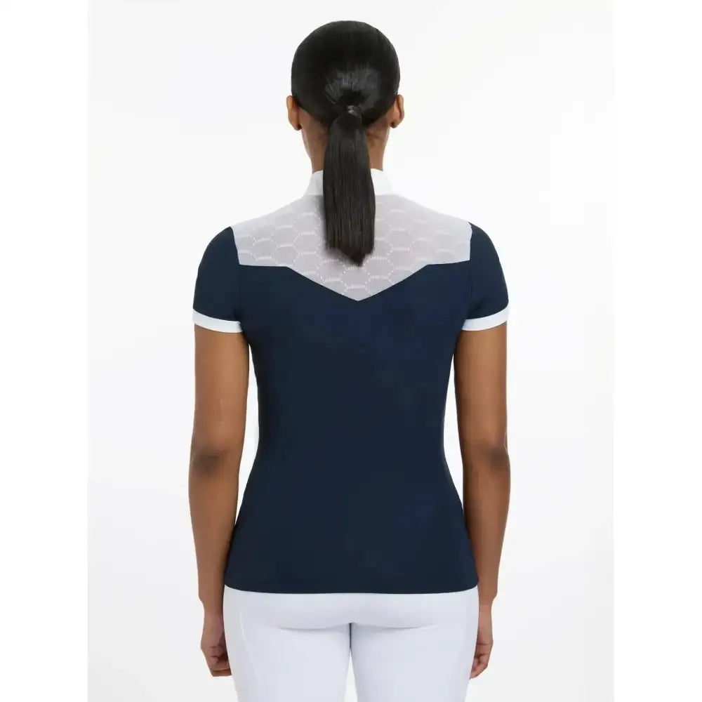 Navy blue lemieux emily short sleeve show shirt with white trim and sheer back panel for equestrian use