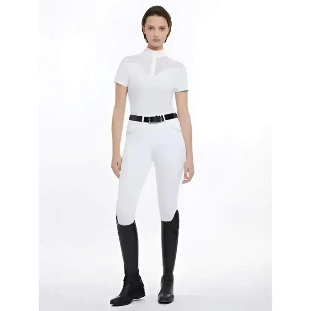 White riding pants with fitted design and black belt paired with lemieux emily short sleeve shirt white