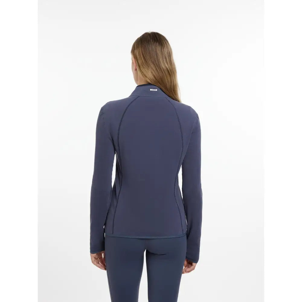 Navy blue lemieux faye fleece zip performance jacket with long sleeves high collar and subtle seam detailing in dusk blue