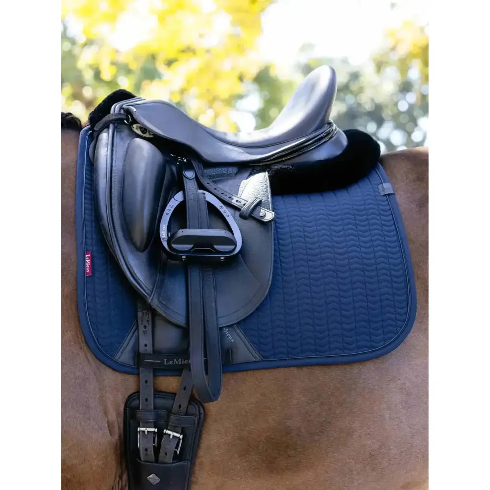 Navy blue lemieux finesse dressage faux leather saddle pad with plush black fur edge finesse dressage square