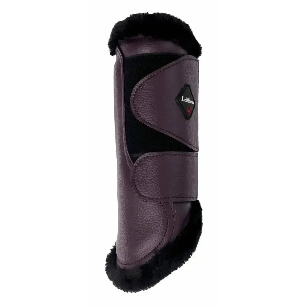 Dark purple lemieux fleece lined brushing boots with black faux fur trim and diamond brand logo in fig color