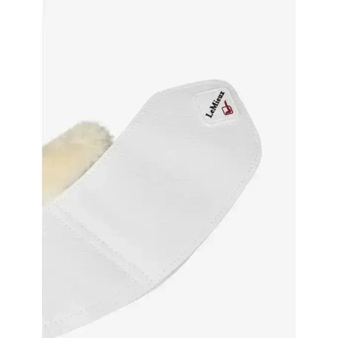 White lemieux fleece wrapround reach boots with soft plush lining and faux leather overreach boots detail