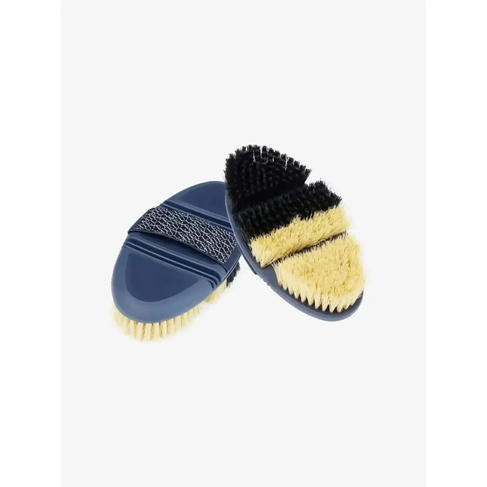 Navy blue lemieux flexi half reversible body brush with black and tan bristles and a textured grip strap for grooming