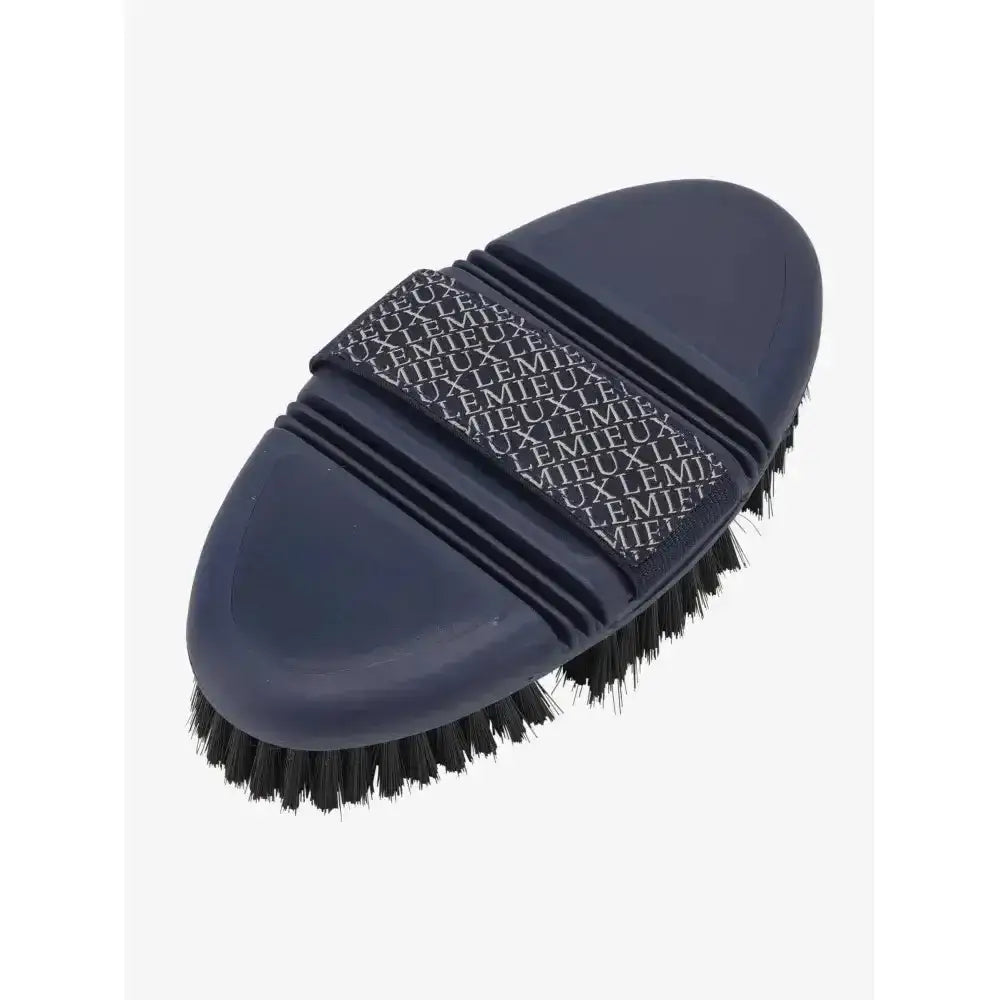 Navy lemieux flexi soft body brush with black bristles and repeating logo pattern handle for grooming use