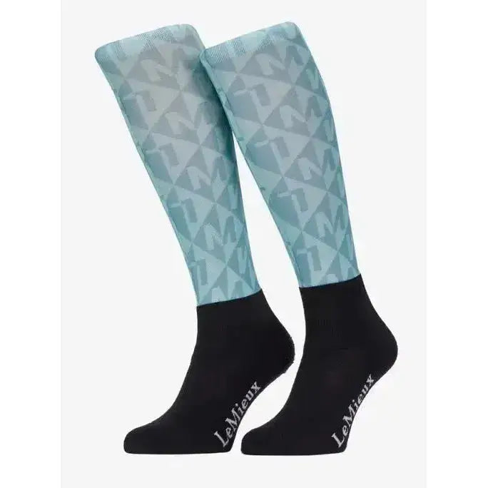Light blue and black lemieux footsie socks clea lagoon with geometric pattern and brand name embroidered on foot