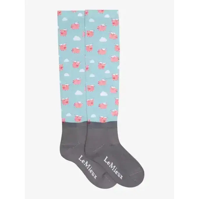 A pair of lemieux footsie socks flying pigs in light blue with pink piglets white clouds and gray cuffs