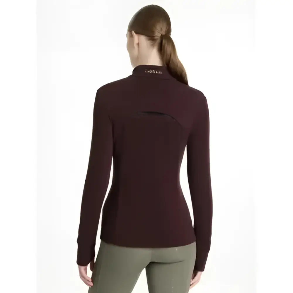 A maroon lemieux fleece damson frances quarter zip with high collar and subtle black back paneling visible
