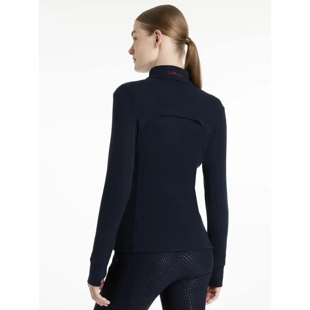 Navy blue lemieux frances quarter zip fleece navy with long sleeves high collar and subtle pink branding at neckline