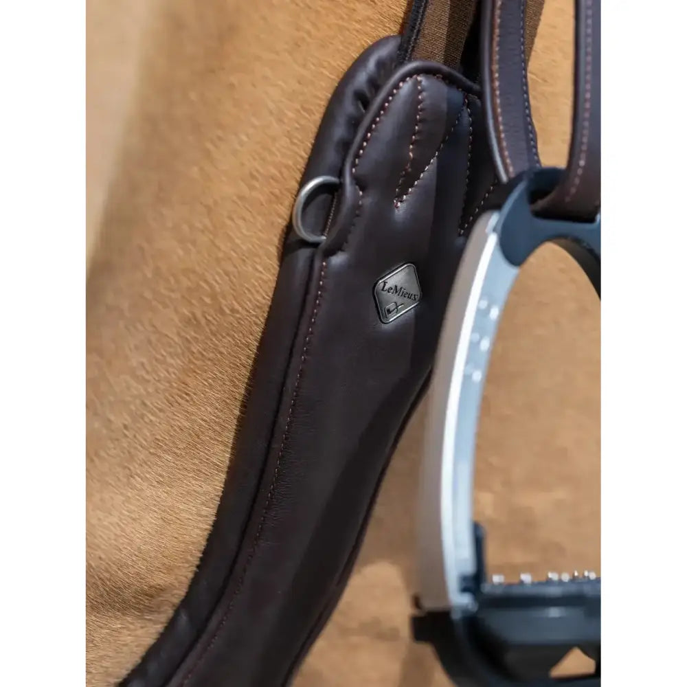 Dark brown ultra soft leather anatomic high performance saddle pad with silver lemieux diamond logo plaque