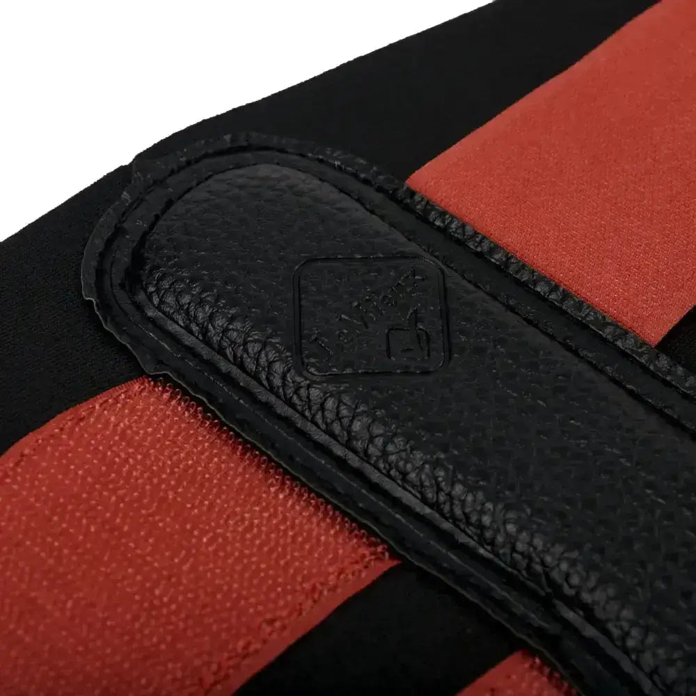 Black leather patch with embossed logo on the back of red and black lemieux grafter boot sienna athletic glove
