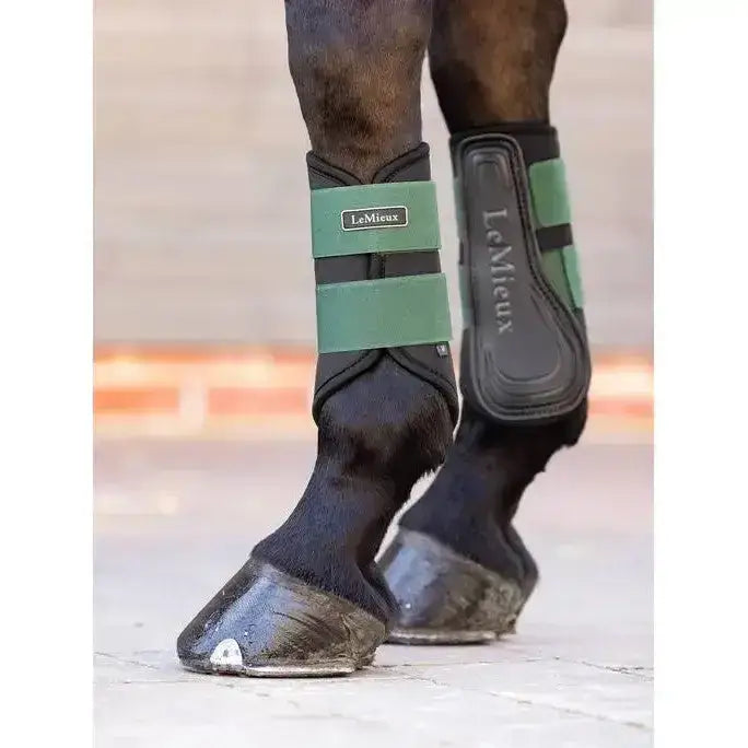 Green and black lemieux grafter brushing boot with padded design for protection and support in hunter green