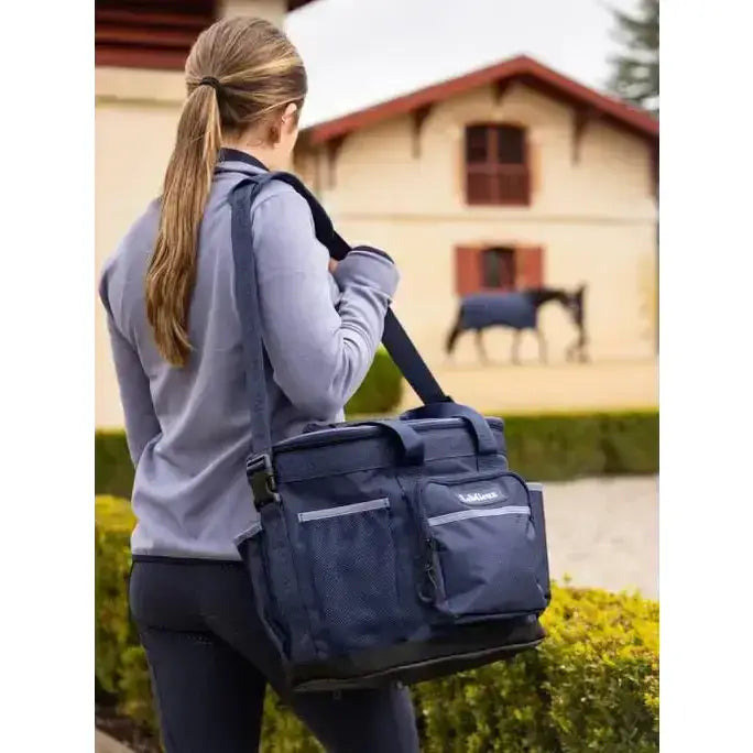 Navy blue lemieux grooming bag made of mesh and fabric with reflective stripes tough grooming carry-all tote bag