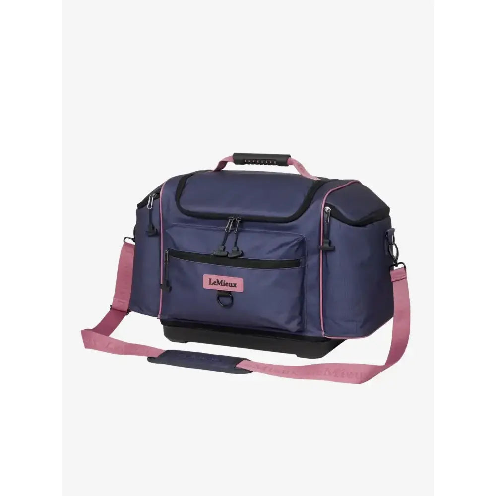 Navy blue and pink lemieux grooming kit pro dusk blue duffel bag with black accents for easy travel and storage