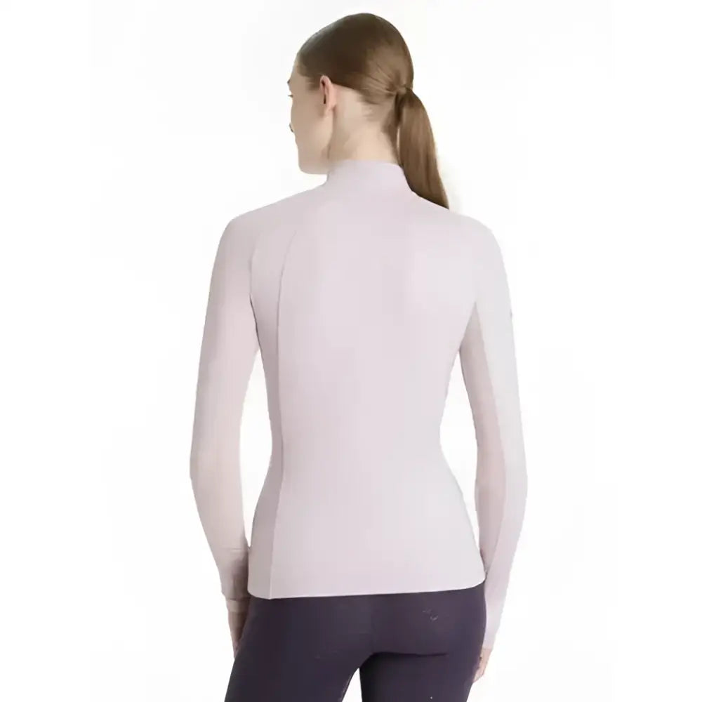 A lemieux halle lightweight lilac long-sleeved base layer with a seamless high neckline for athletic wear
