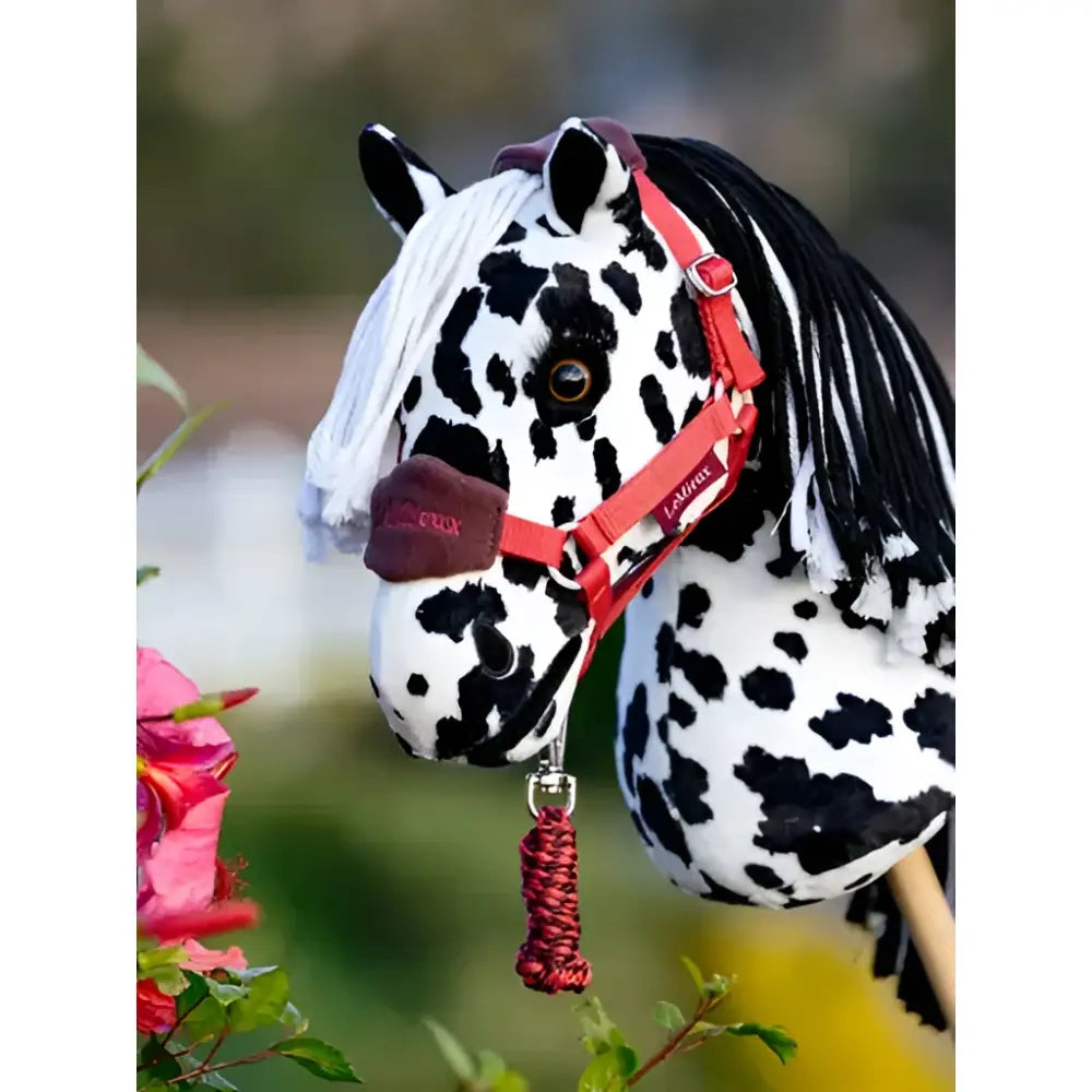 Lemieux hobby horse dakota with black and white spots red halter and braided tassel perfect for mini riders