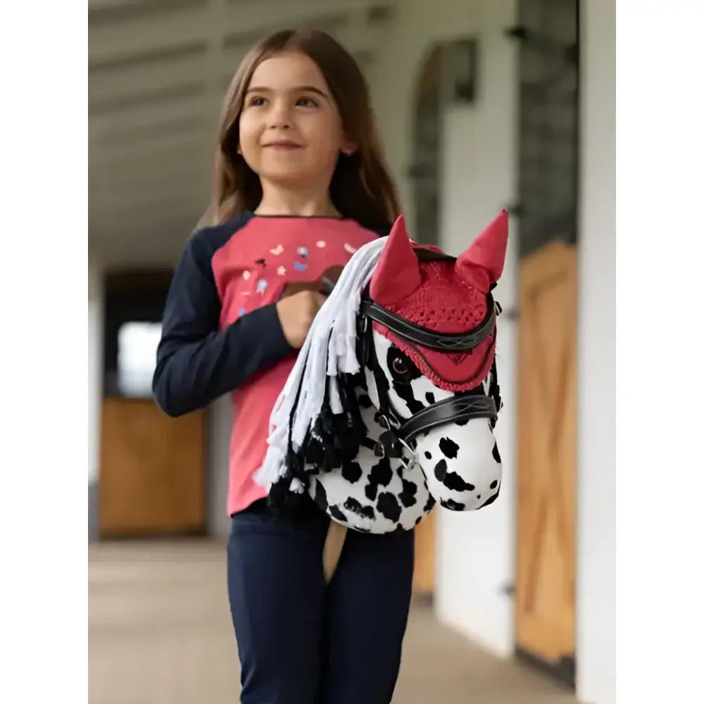 Red and white dalmatian-patterned lemieux hobby horse dakota head toy with black leather straps for mini riders