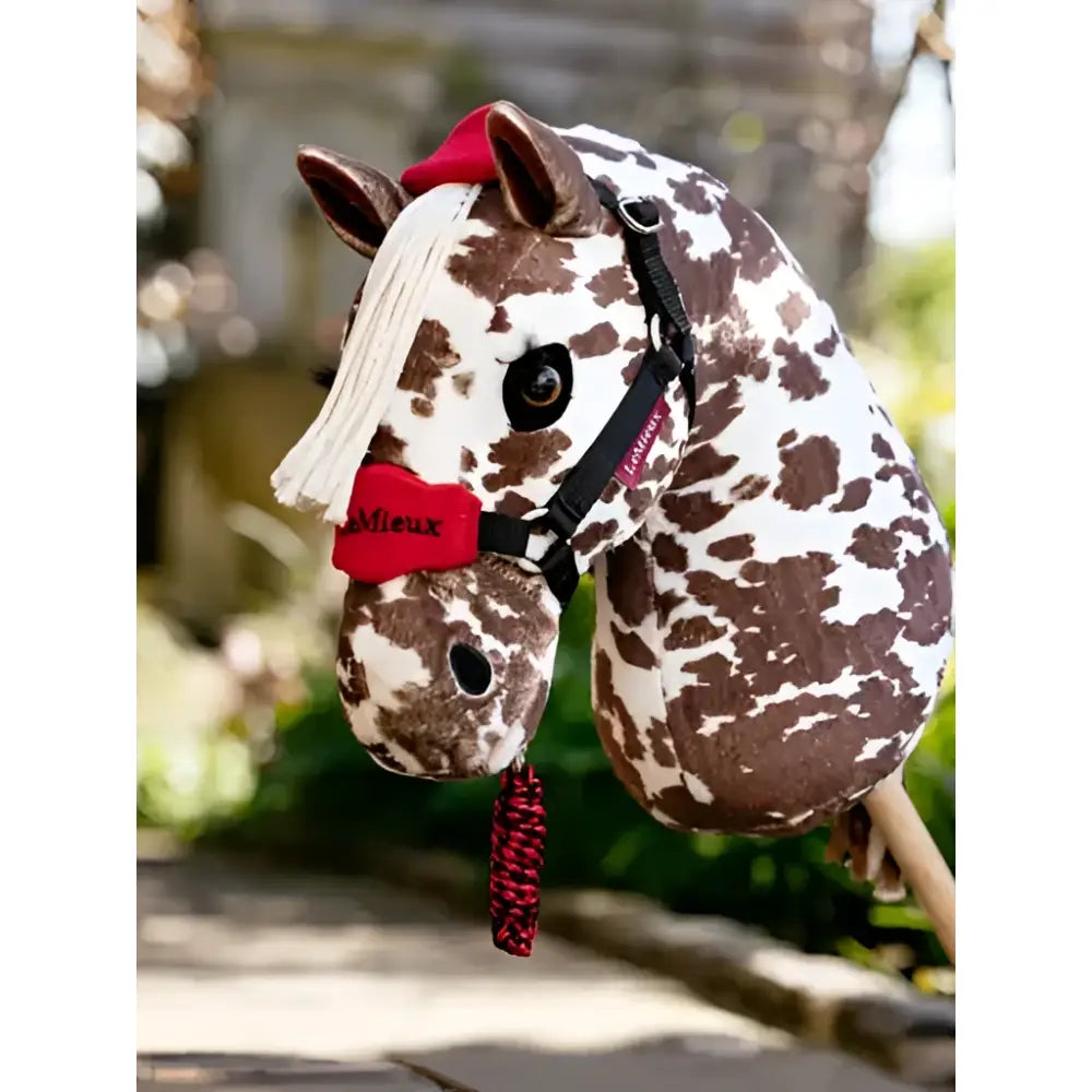 Brown and white spotted plush lemieux hobby horse ride-on with red leadrope chilli and vogue headcollar accents