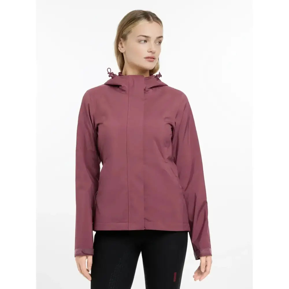 A sleek maroon lemieux isla short waterproof jacket rosewood with hood and subtle drawstrings