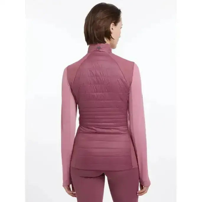 A mauve quilted puffer lemieux juliette gilet with high collar and long sleeves worn over matching leggings in rosewood