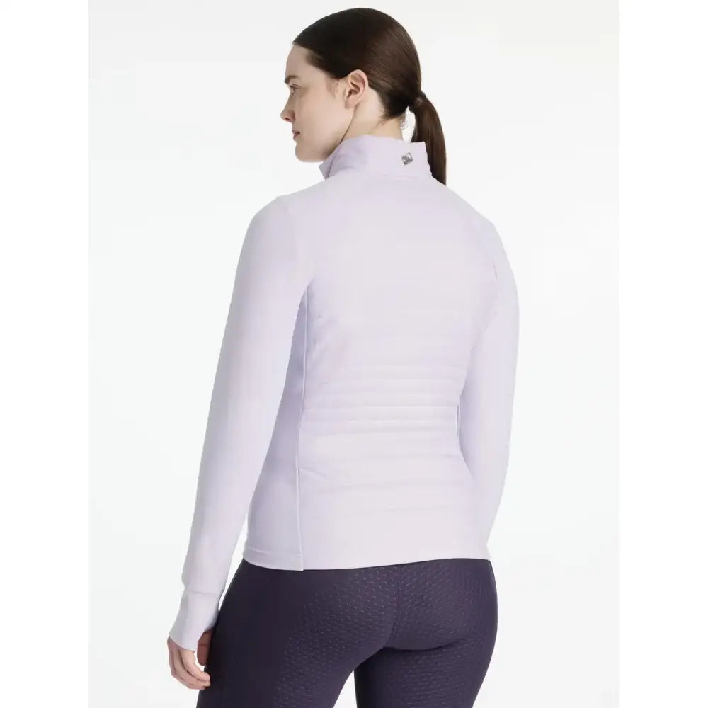 A light lavender lemieux juliette jacket lilac with long sleeves high neck and subtle textured fabric perfect for workouts