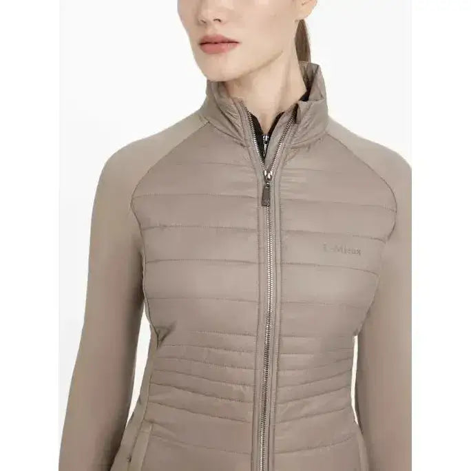 Beige quilted zip-up lemieux juliette jacket pecan with high collar and subtle chest logo perfect for cool days