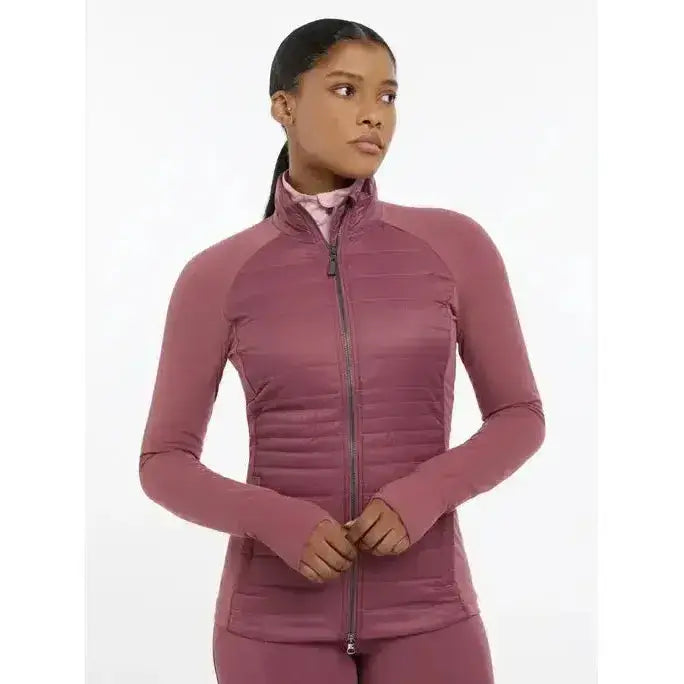 A mauve quilted zip-up athletic jacket with long sleeves and high collar lemieux juliette jacket rosewood