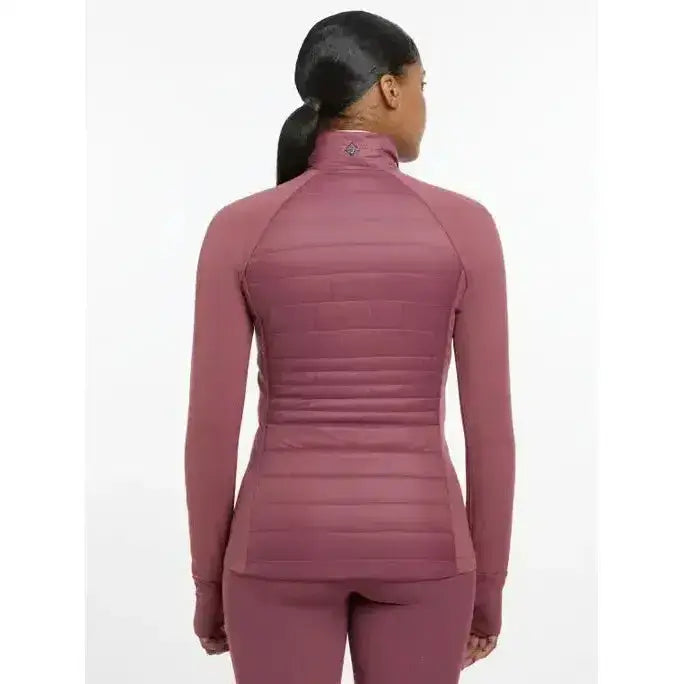 Back view of mauve lemieux juliette jacket rosewood with quilted back and high collar in long-sleeve athletic style