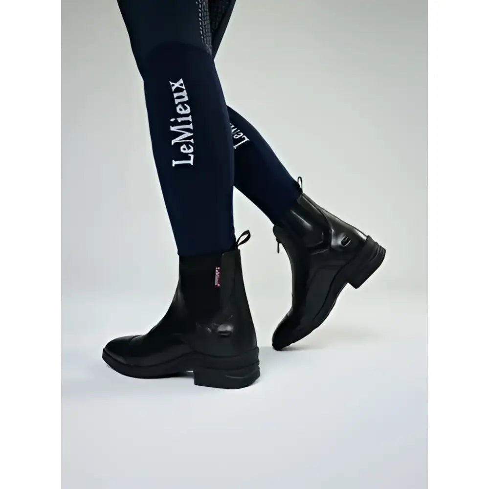 Black leather lemieux junior zip paddock boot with low block heel and zipper closure for riding use