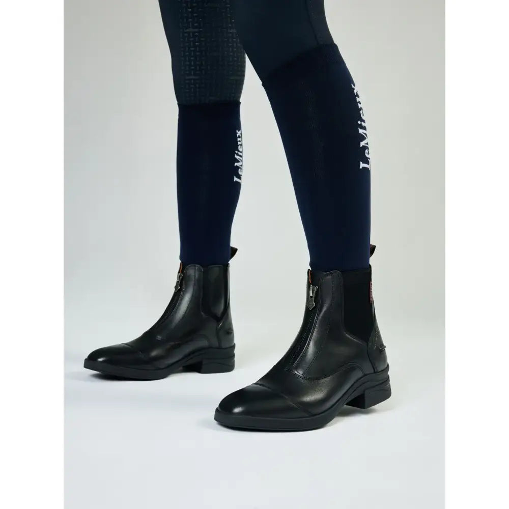 Black leather lemieux junior zip paddock boot with zipper closure and low block heel for riding in paddock boot black style